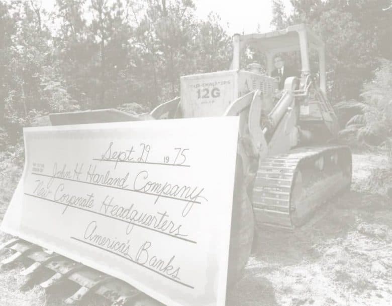 tractor with large check for new headquarters 1970s
